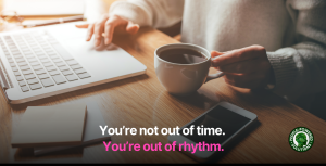 Person working on a laptop with a cup of coffee, and a phone on the wooden desk. Overlay text reads: 'You're not out of time. You're out of rhythm.' People-Powered Solutions logo in the corner. Time management concept.