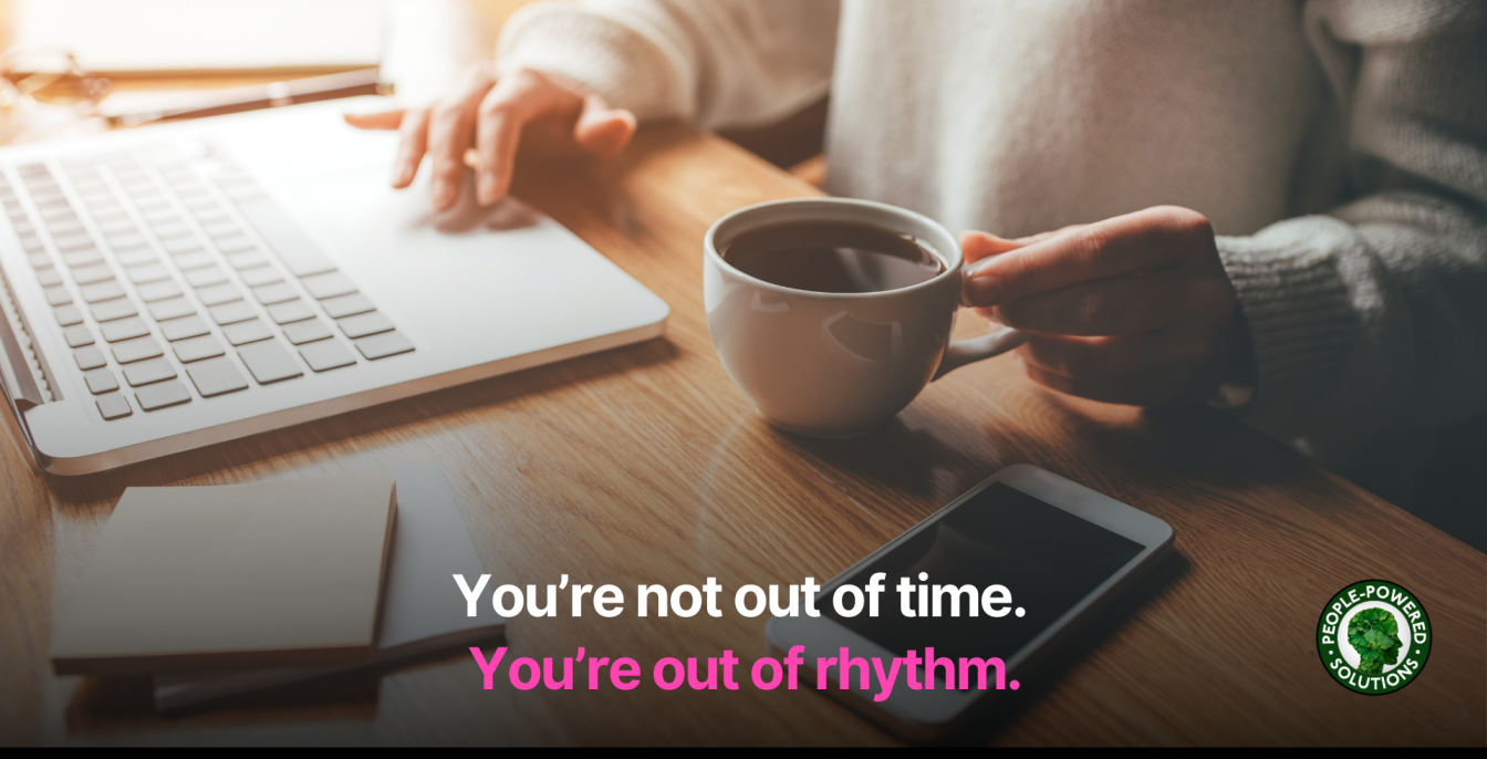 Time Management for Leaders: Why It’s So Hard — and What Actually Helps 1 Person working on a laptop with a cup of coffee, and a phone on the wooden desk. Overlay text reads: 'You're not out of time. You're out of rhythm.' People-Powered Solutions logo in the corner. Time management concept.