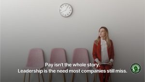 An employee sitting in a row of chairs waiting for an exit interview